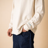 Cultivate what matters crewneck details: Studio photography of sleeve embroidery and iconic it's okay label.